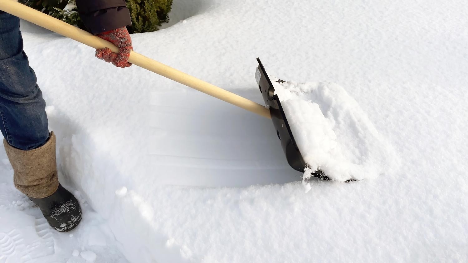 A person using a snow shovel