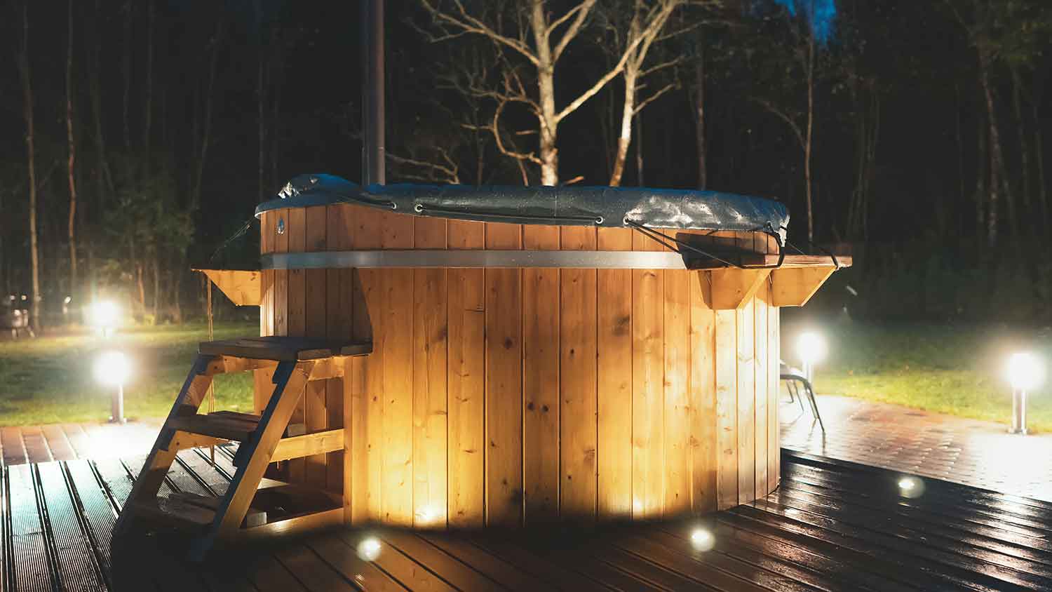 Soft hot tub cover installed on top of a wooden hot tub