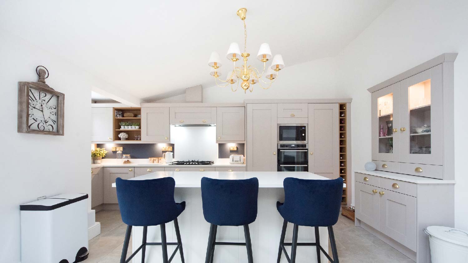 A spacious kitchen with a chandelier