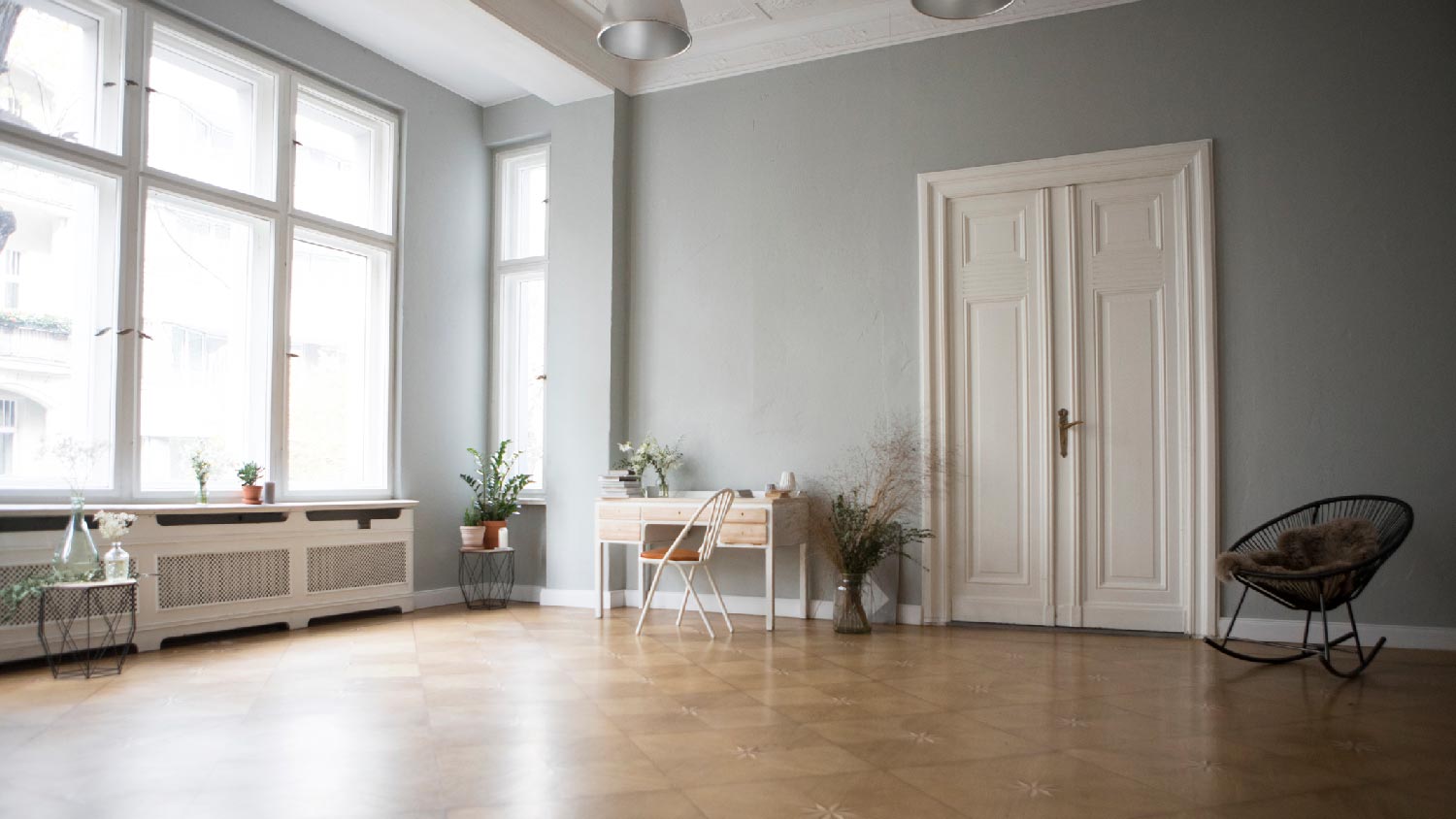 A spacious living room with a white double door