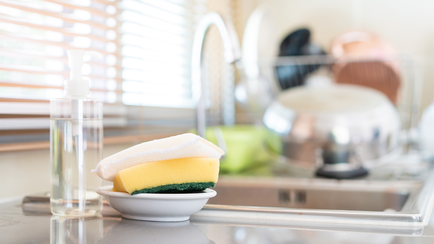 sponges on the side of the kitchen sink