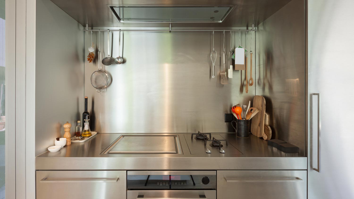  A small kitchen with a stainless steel countertop