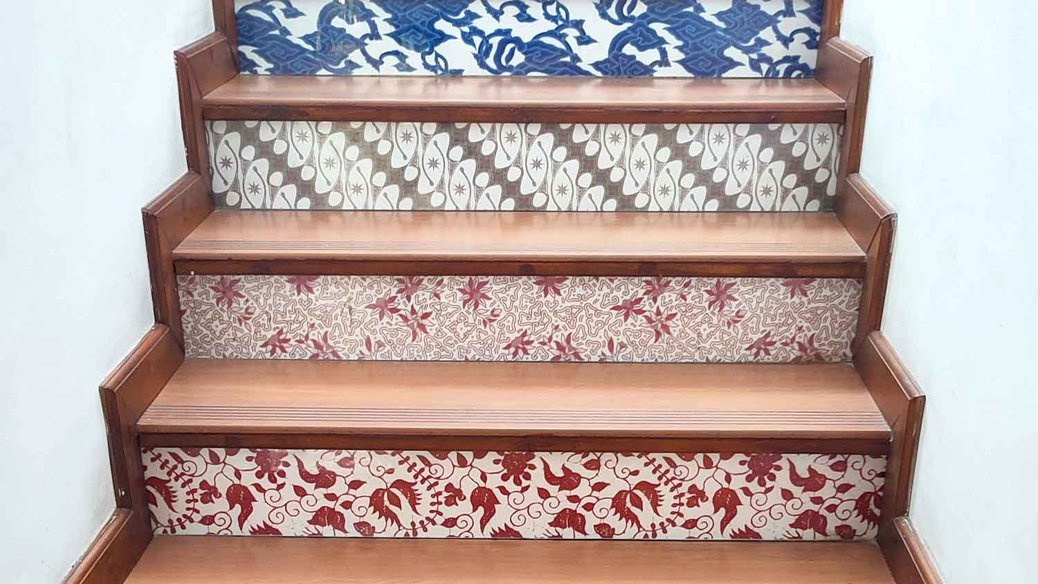 Wallpaper with various patterns installed on staircase risers