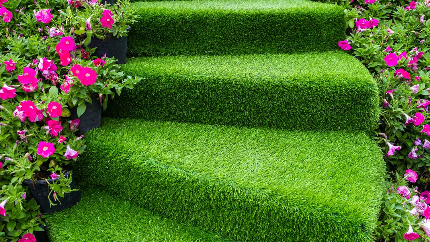 Closeup of patio stairs covered with artificial grass