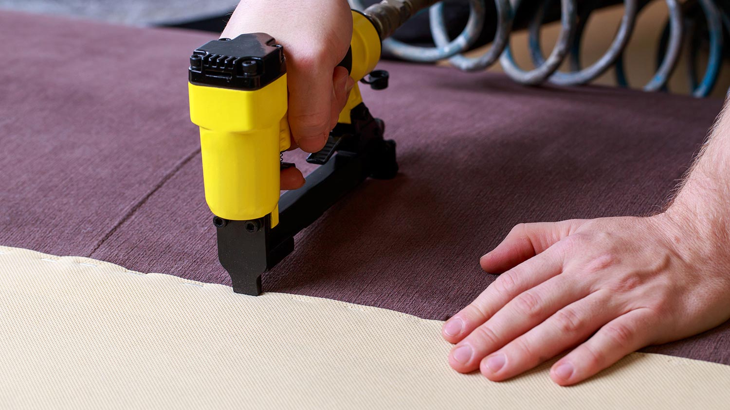 Stapling fabric to headboard