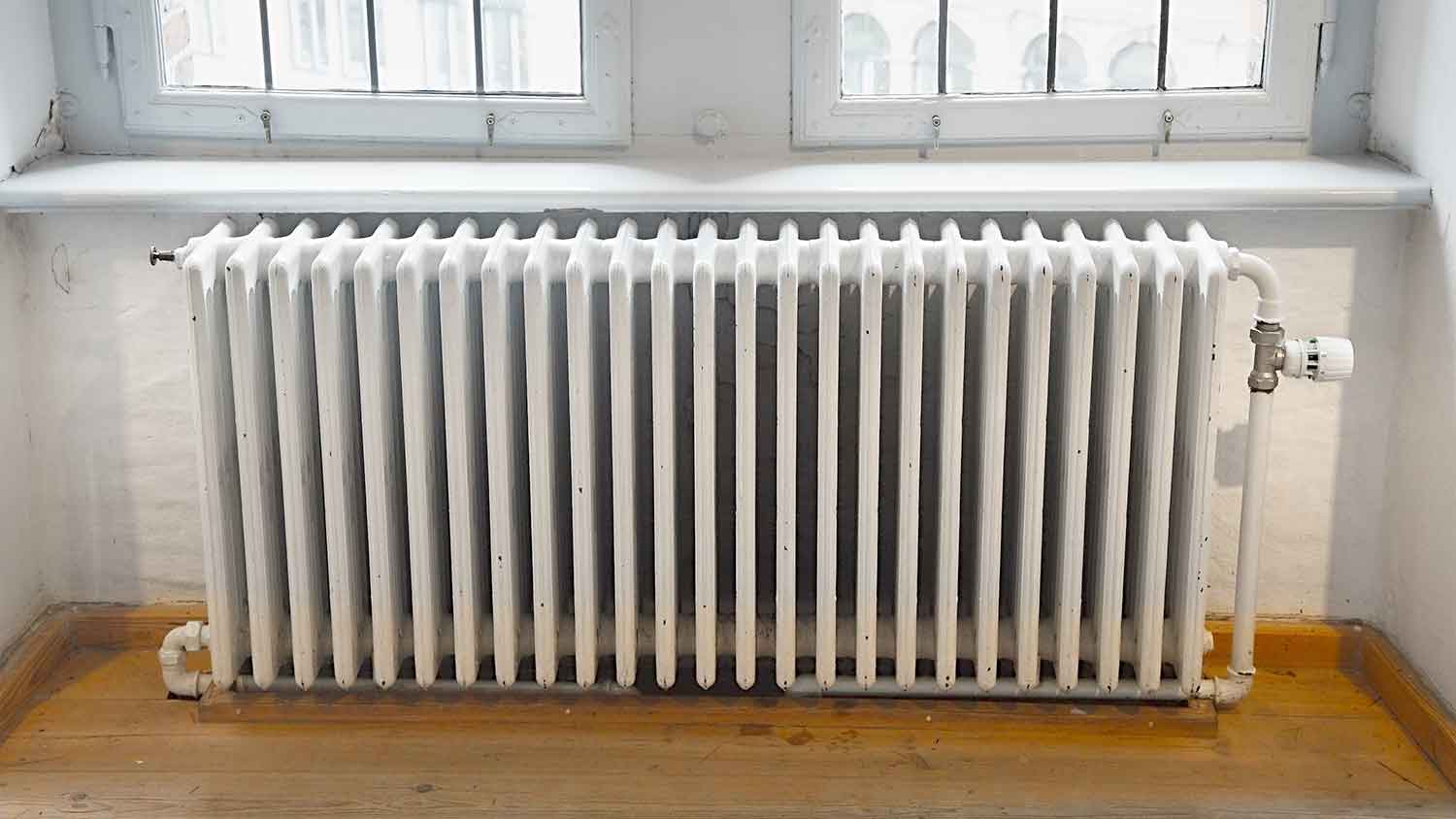 Steam radiator installed by two windows