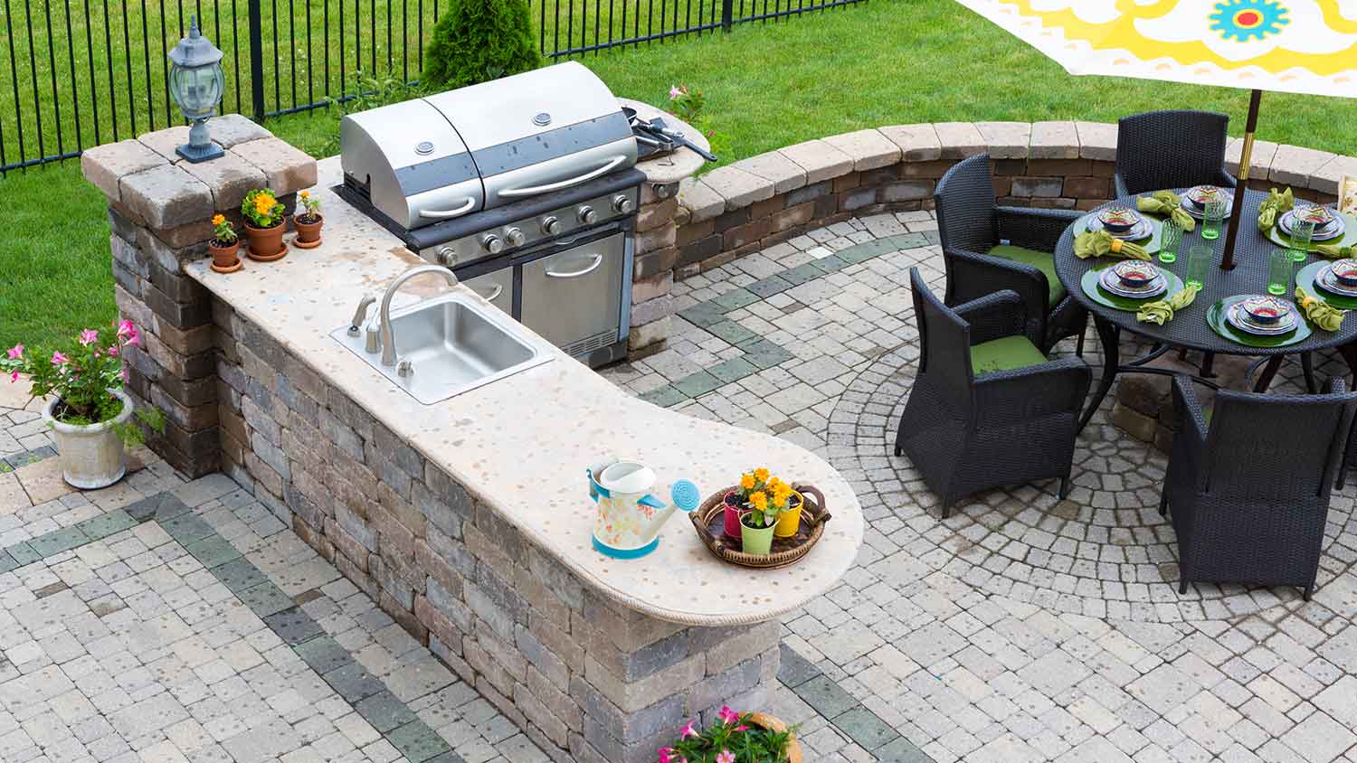 Patio with outdoor kitchen and dining table