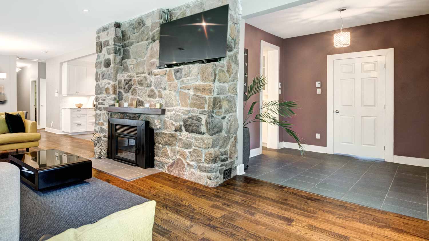 living room with stone veneer