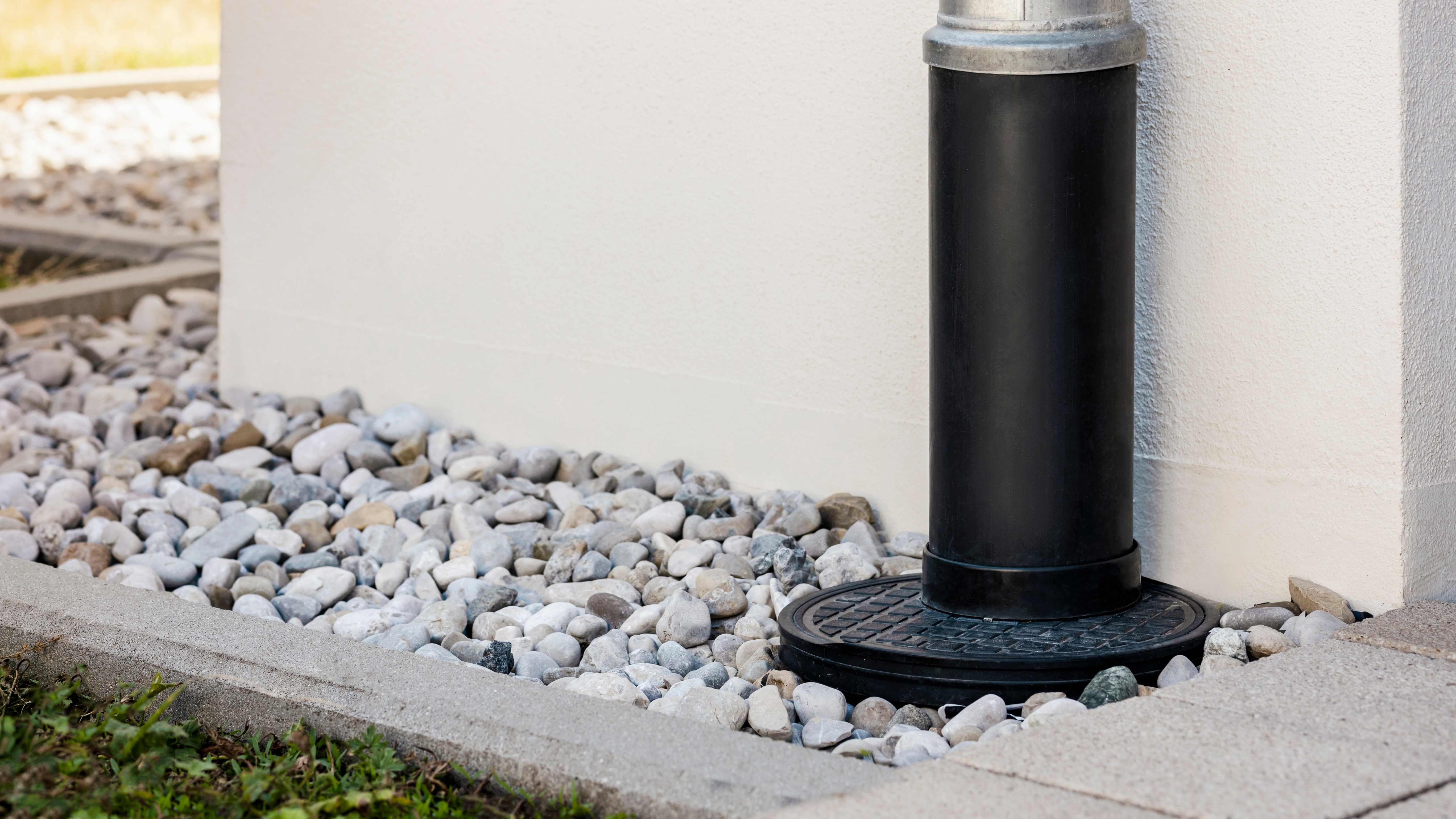 Gutter downspout and a French drain installed in the yard