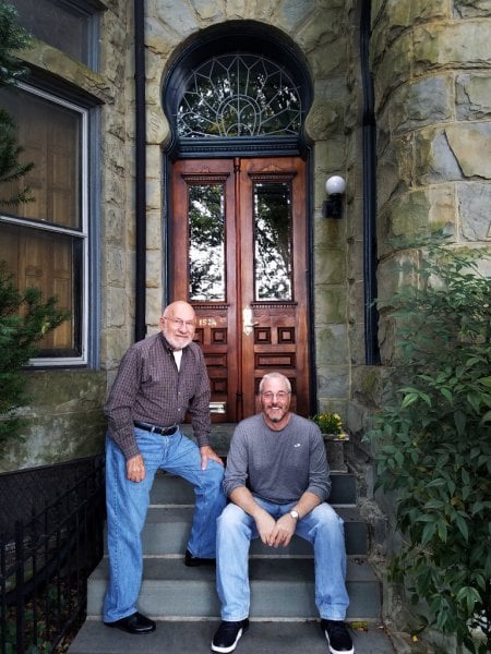 Baltimore homeowners Thom Shipley and Chris Taylor in front of their remodeled historic home