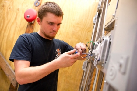 electrical apprentice wiring a light switch
