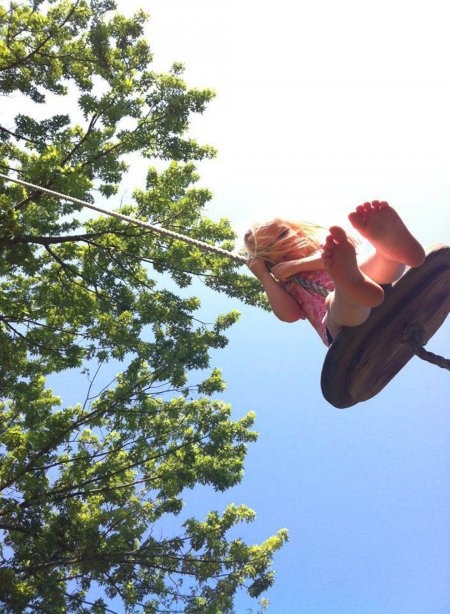 girl on tree swing