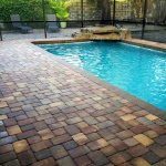 Pool with lanai and brick patio