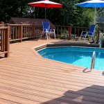 Above-ground pool with composite deck and chairs