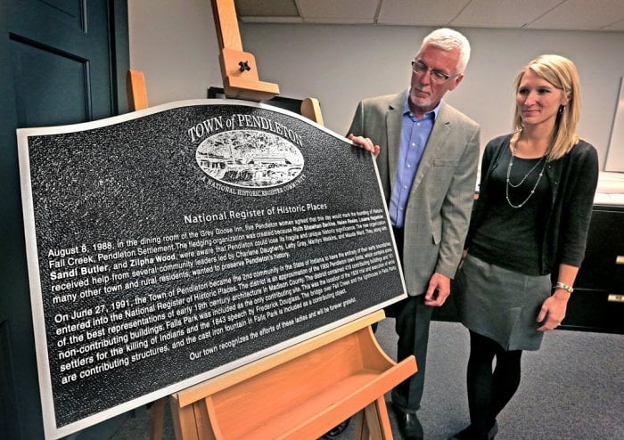 Pendleton, Indiana Town Manager Tim McClintick and Planning/Zoning coordinator Rachel Christensen and a historic marker.