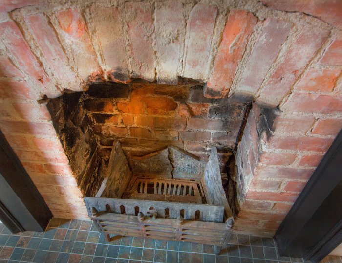 An old brick fireplace in a Herron-Morton home in Indianapolis