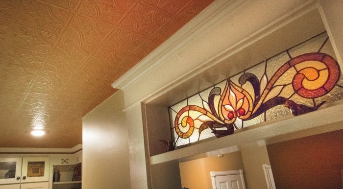 A tin textured ceiling and stained glass in a Pendleton, Indiana home.