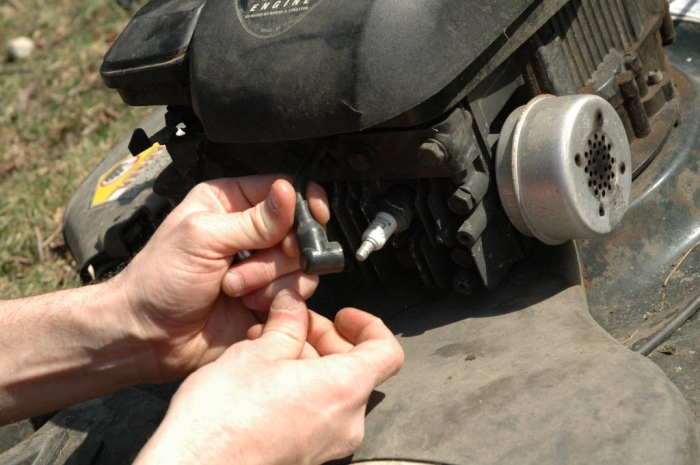 Changing a lawn mower spark plug
