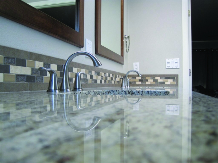 bathroom remodel with custom tile and sink