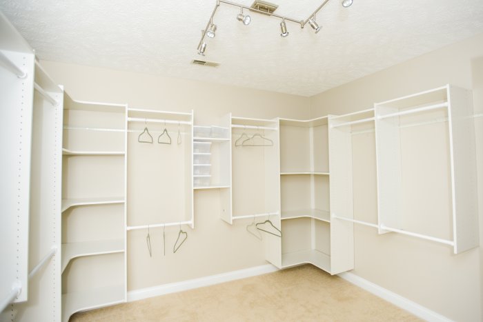 closet with track lighting on ceiling