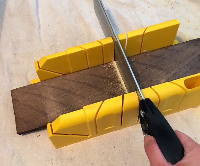cutting weathered hardwood wall boards