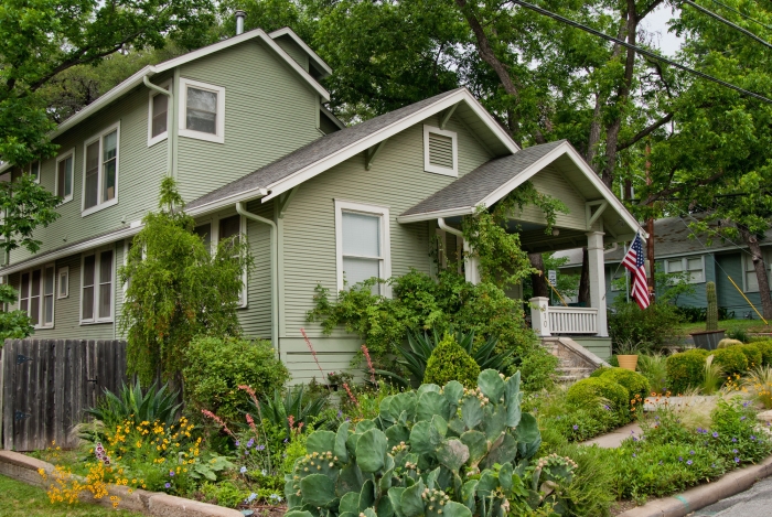 home exterior with lush landscaping