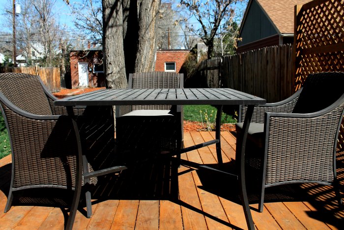 patio furniture three chairs and table on deck