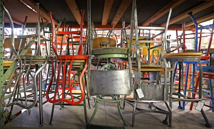 metal chairs at a salvage shop