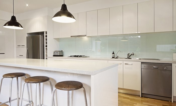 white kitchen with task lighting and pendant lighting