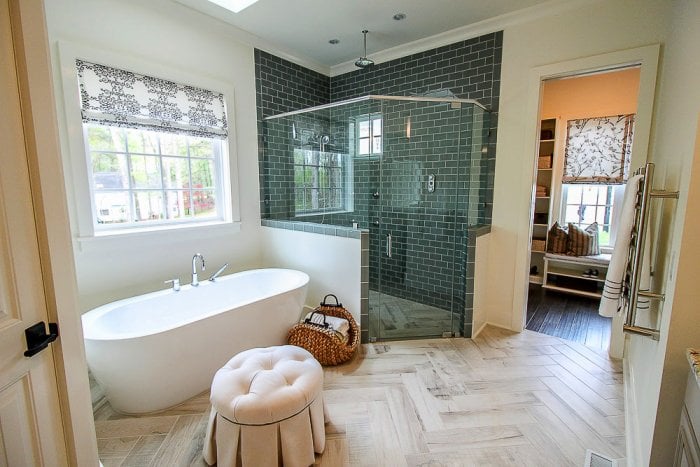 spa-like bathroom with seating and large tub