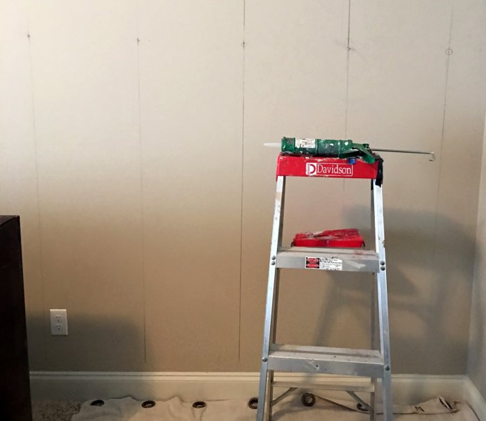 measuring wall to add wood planks