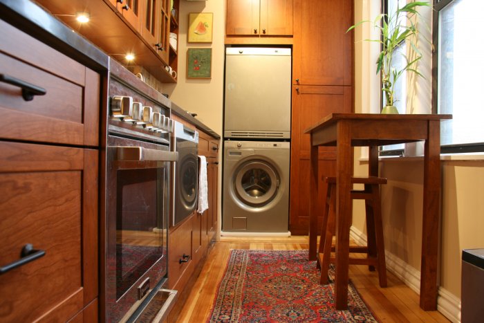 Stacked washer and dryer in kitchen