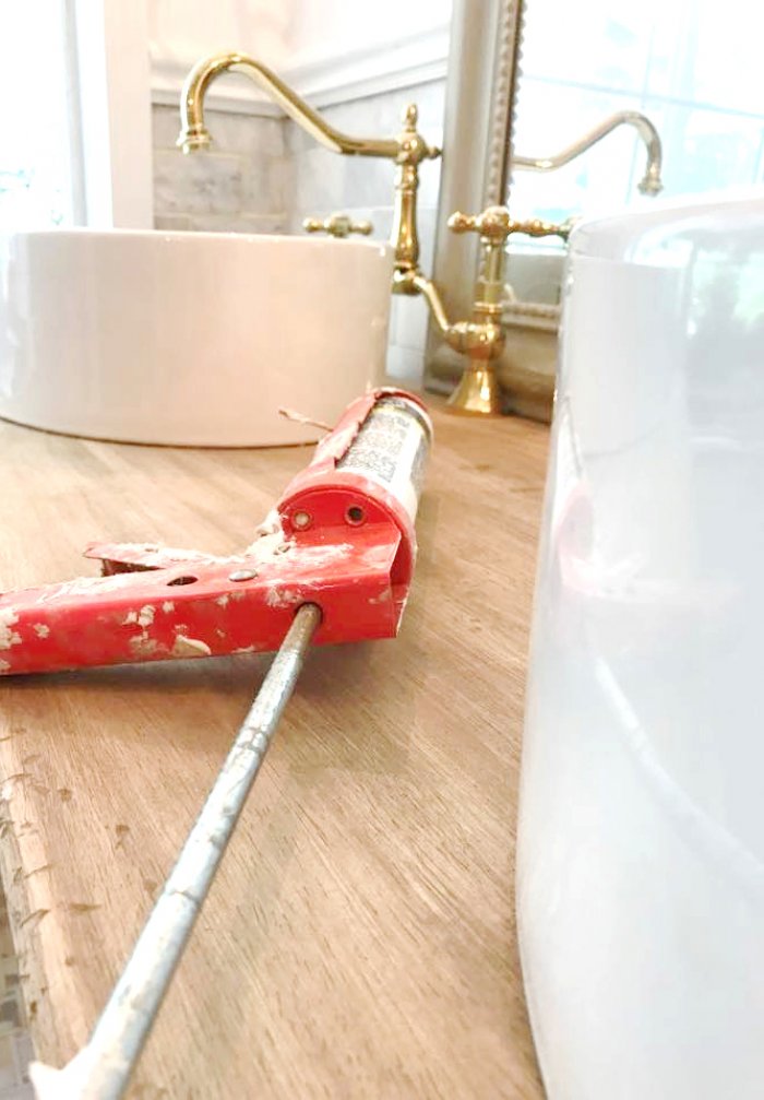 Place the sink on top of the vanity before making any cuts to determine placement. (Photo courtesy of Courtney A/The French Country Cottage)