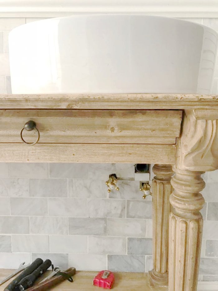 The console fit the space perfectly and would enhance the bathroom's look. (Photo courtesy of Courtney A/The French Country Cottage)