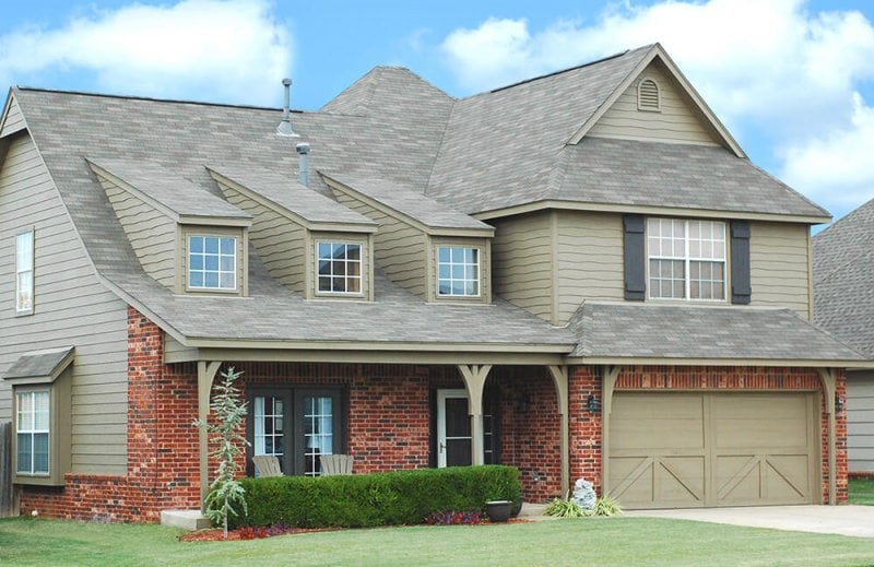 Suburban house with brick and siding exterior Suburban house with brick and siding exterior (Photo by rickmartinez/iStock / Getty Images Plus/Getty Images)