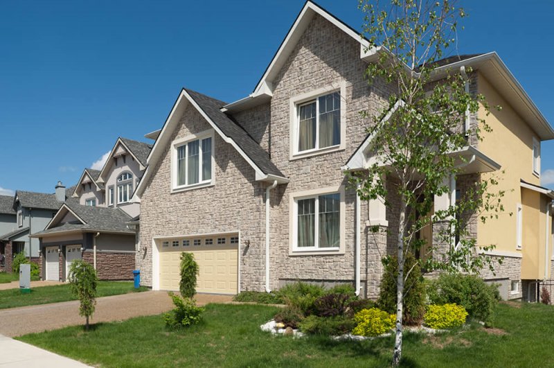 Suburban neighborhood house with brick exterior Suburban neighborhood house with brick exterior (Photo by IP Galanternik D.U./E+/Getty Images)
