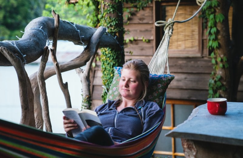 woman reading book in hammock (Photo by tdub303/iStock/Getty Images Plus via Getty Images)