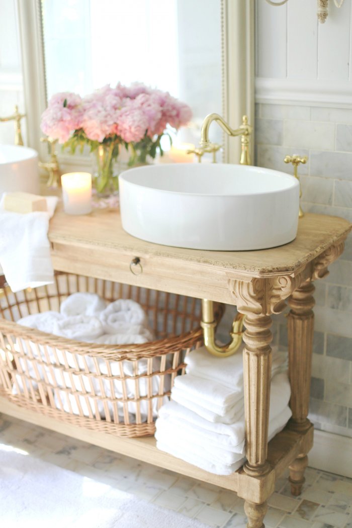 Avoid breaking the bank by building your own vanity from a console. (Photo courtesy of Courtney A/The French Country Cottage)