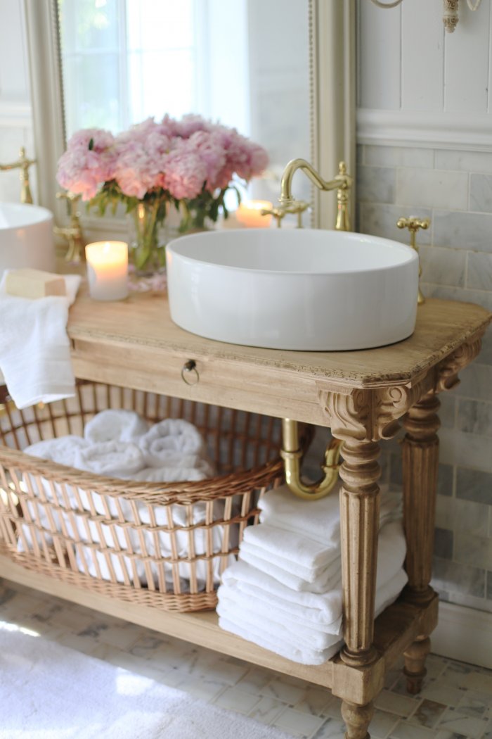 The new vanity adds plenty of counter space and storage to the bathroom. (Photo courtesy of Courtney A/The French Country Cottage)