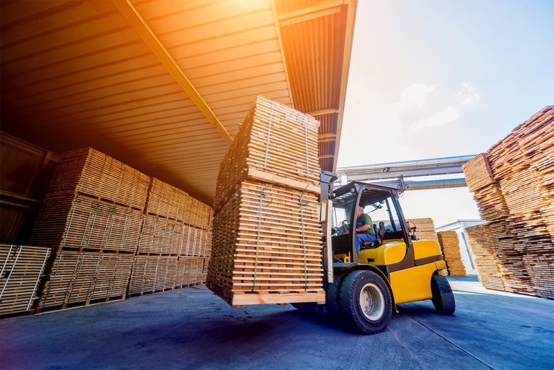 Lumber being moved to storage (Photo by Romaset - stock.adobe.com)