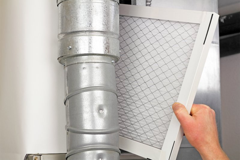 Brand new furnace filter to be installed (Photo by Serenethos - stock.adobe.com)