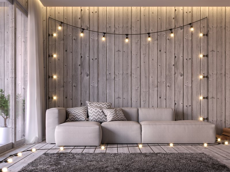 Living room with string lights Living room with string lights (Photo by onzon - stock.adobe.com)