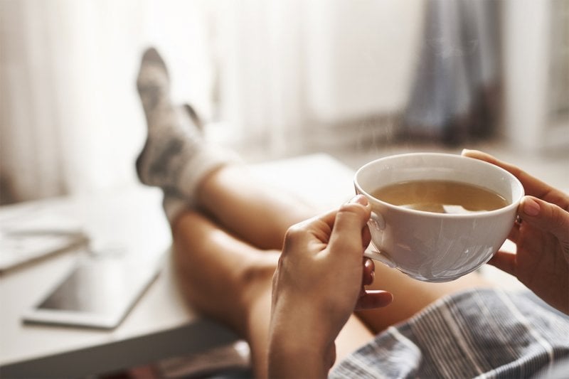 Woman holding a coffee mug (Photo by Cookie Studio - stock.adobe.com)