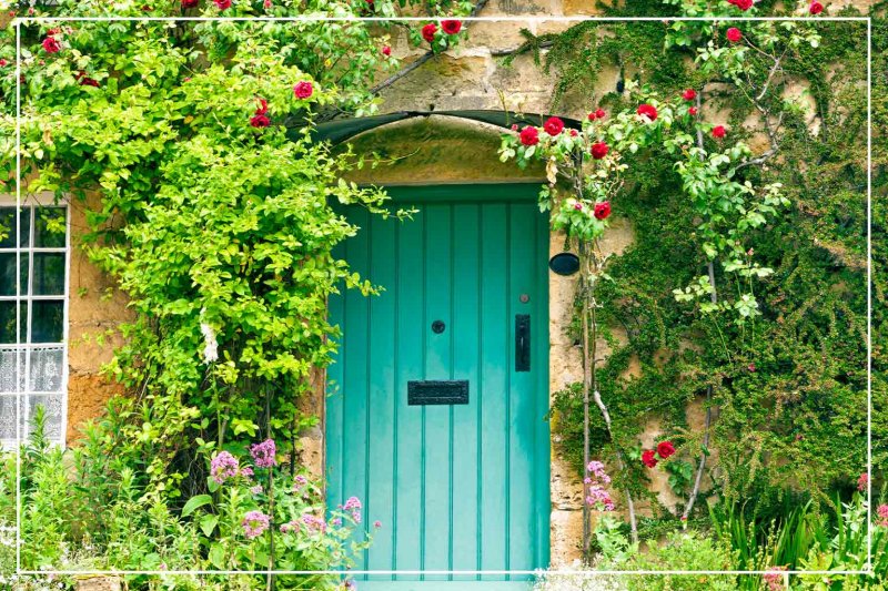 aqua color front door (Photo by YolaW/iStock/Getty Images Plus via Getty Images)