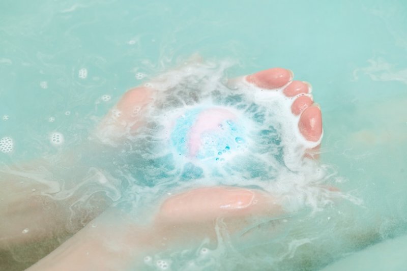 Bath ball in female hands (Photo by HappyNati / iStock / Getty Images Plus via Getty Images)