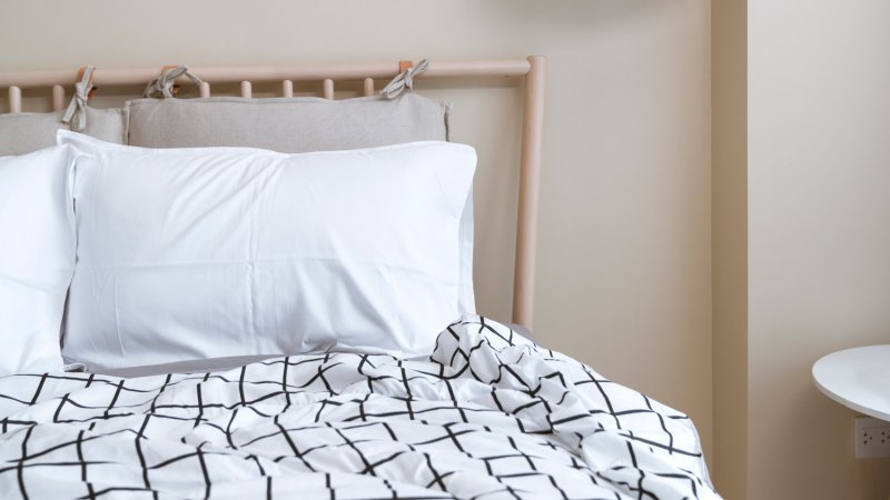 Close-up of a bed in a white bedroom (Photo by Somyot Techapuwapat/Moment via Getty Images)
