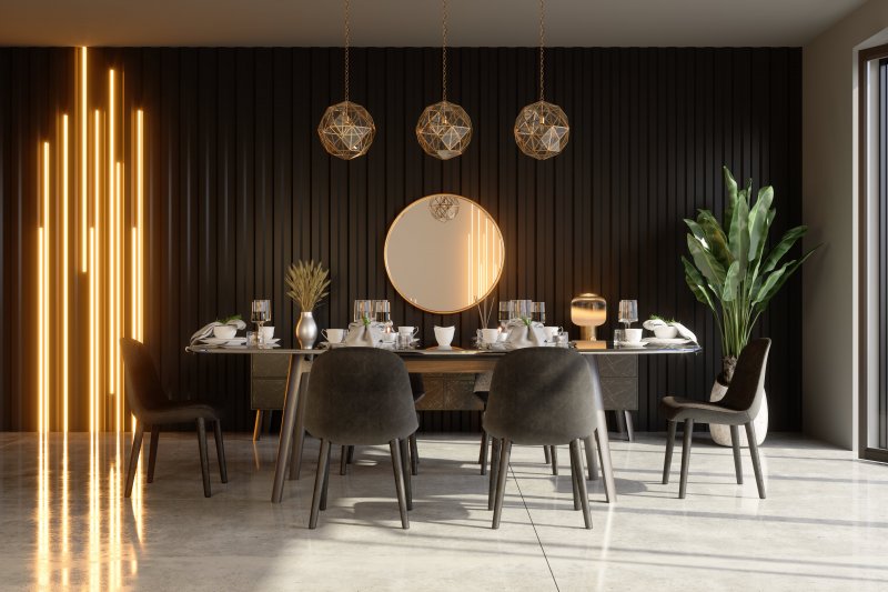 Black geometric patterned accent wall modern dining room (Photo by Onurdongel /E+ via Getty Images)