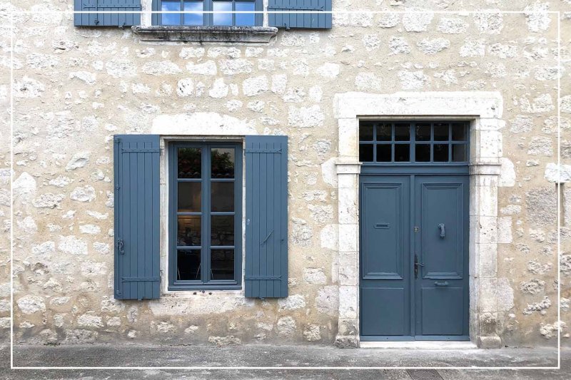 blue-gray color front door (Photo by cmspic/iStock/Getty Images Plus via Getty Images)