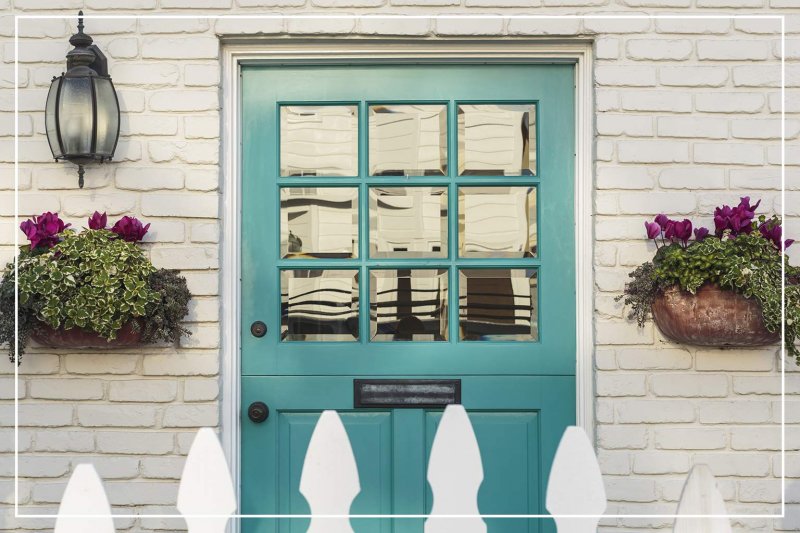 blue-green color front door (Photo by David Papazian/Shutterstock.com)
