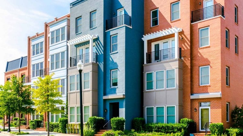 Row of brick townhouses in Alexandria, VA (Photo by Grace Cary/Moment via Getty Images)